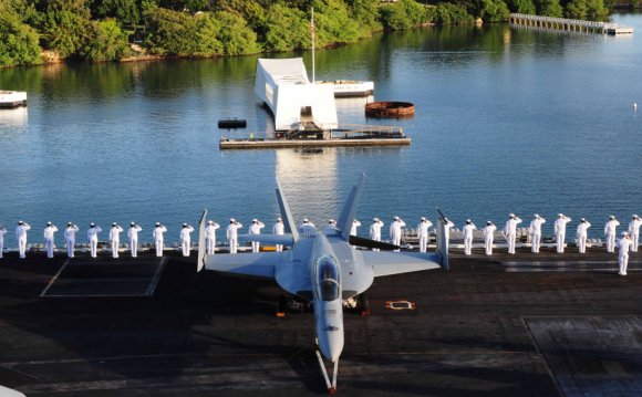 76) visiting Pearl Harbor