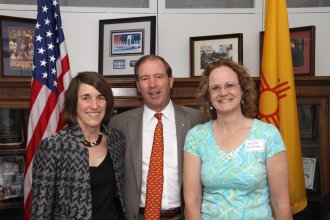 AHF President Cindy Kelly and Los Alamos Historical Society Executive Director Heather McClenahan with New Mexico Senator Tom Udall