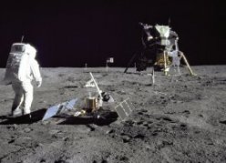 Here is Buzz Aldrin,  who piloted the lunar module to the moon's surface,  with the LR-3,  a reflecting array designed to bounce laser beams fired from Earth back to Earth. This experiment,  which helped refine our knowledge of the moon's distance and the shape of its orbit around Earth,  is still returning data from the moon.